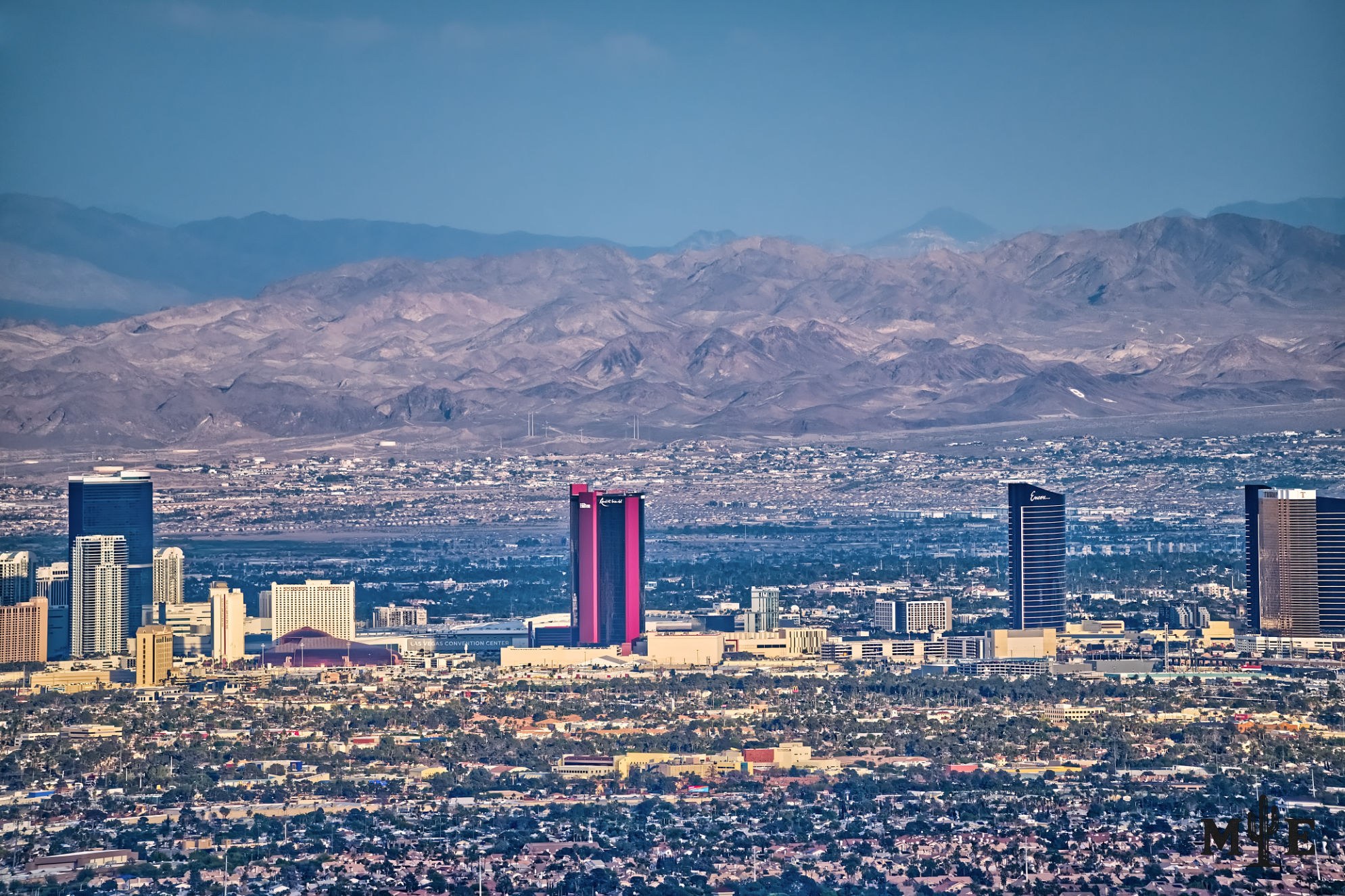Detailed collection of an array of densely packed resort properties and detailed city life in the valley below.