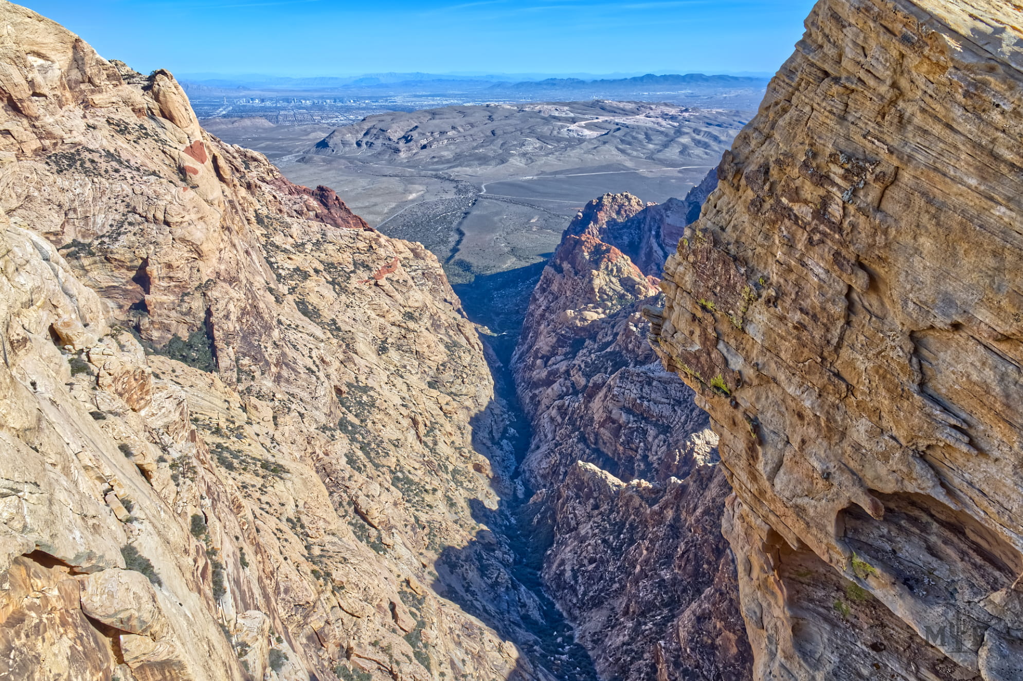 Extremely rugged sandstone overlook and canyon with a ravine at the bottom. Captured in Red Rock Canyon NCA.
