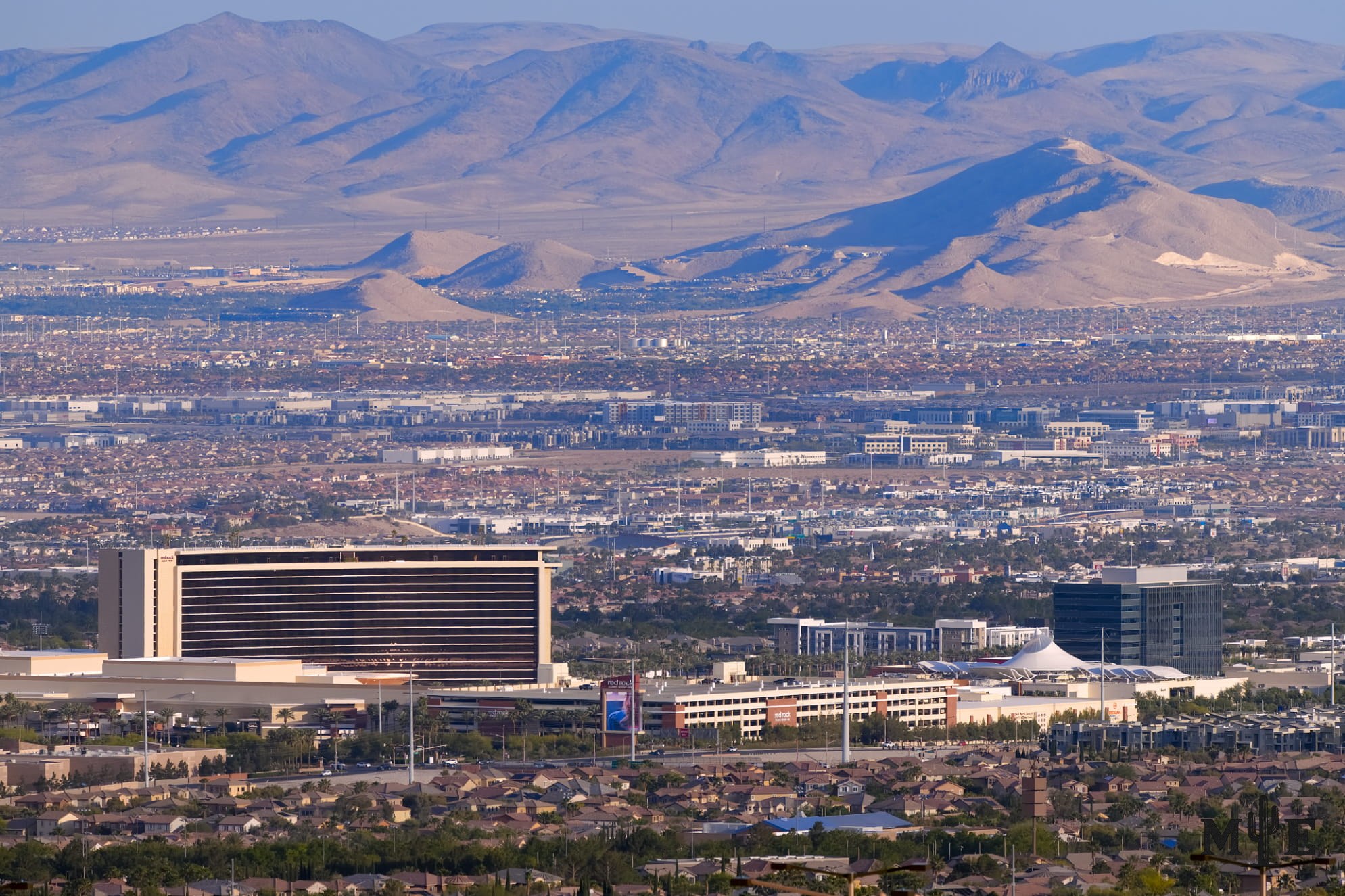 Downtown Summerlin and Red Rock Resort overlooking the Las Vegas Valley. Rugged desert mountains and the shopping district.